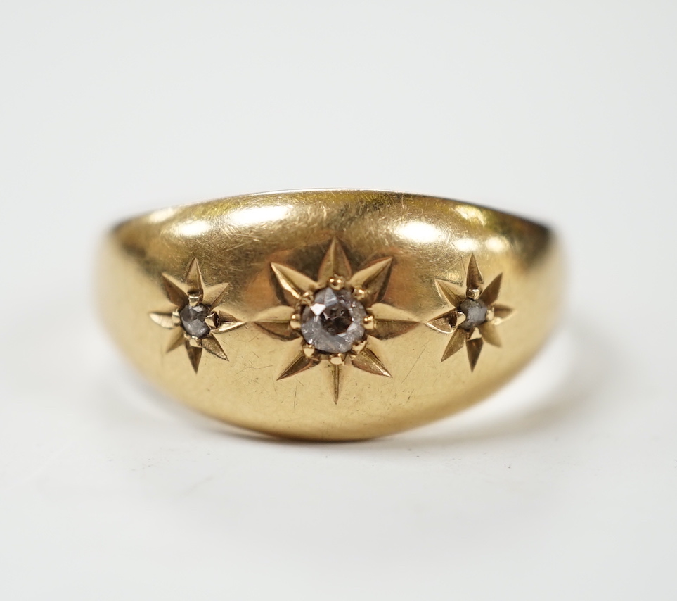 A George V 18ct gold and three stone gypsy set diamond chip set ring, size R, gross weight 3.3 grams.